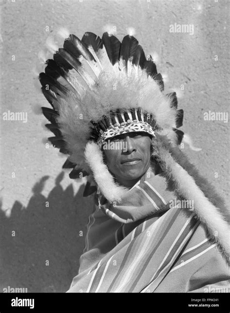 1930s Portrait Native American Indian Man Wearing Full Feathered