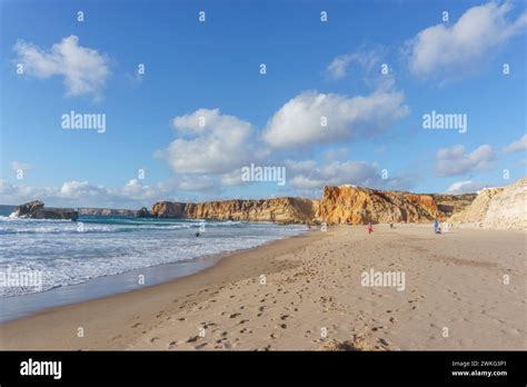 Rock formations in golden sunlight at Praia do Tonel beach, Sagres ...