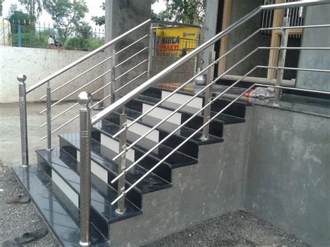 silver stainless steel staircase hand railing  home  feet