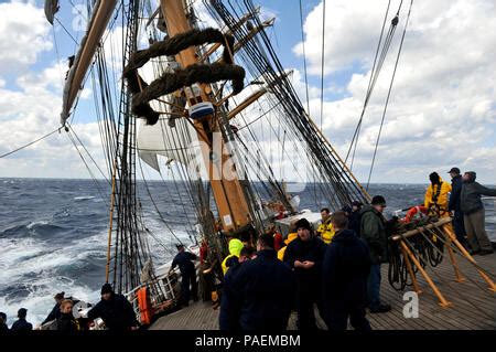 The Coast Guard Cutter Eagle Sails In The Atlantic Ocean Followed By A