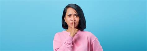 Premium Photo | Portrait of beautiful asian woman making silent gesture ...
