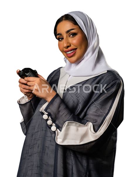 Portrait Of A Saudi Arabian Gulf Woman Wearing A Saudi Abaya Holding A