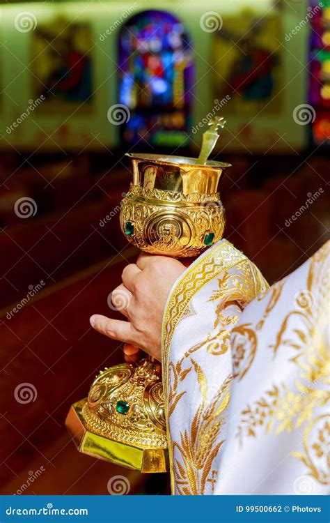 Catholic Priest With Chalice Cup During Consecration Ceremony Stock