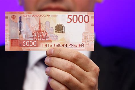 ЦБ показал новые купюры номиналом 1000 и 5000 РБК