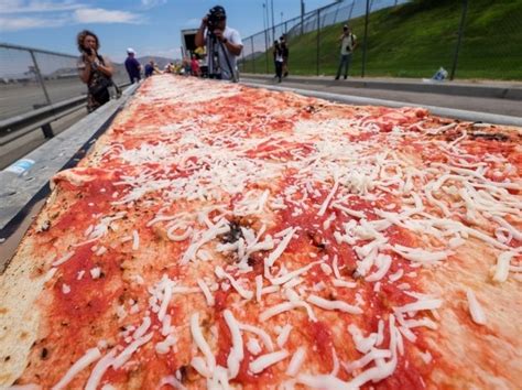 19 Km Long Pizza Cooked By Over 100 Chefs Sets Guinness World Record Business Standard News