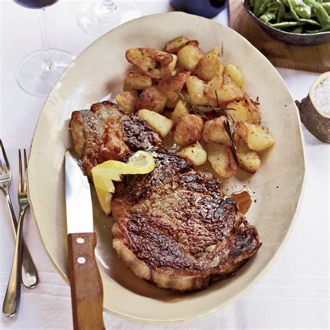 Grilled Rib Eye Steaks With Roasted Rosemary Potatoes Recipe Food And Wine