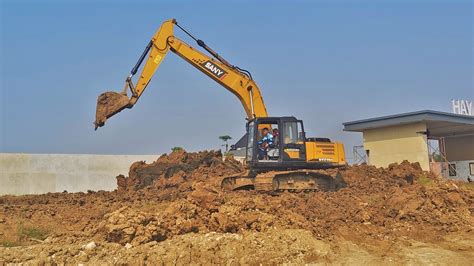 Excavator Dump Truck Digging Limestone On Road Construction Kobelco