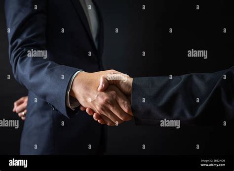 Business Agreement And Successful Negotiation Concept Businessman In Suit Shake Hand With