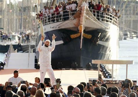 Paris Olympic Flame Arrives In France By Ship From Greece The Japan News