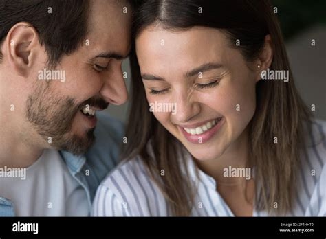 Close Up Happy Man And Woman Touching Foreheads Expressing Love Stock