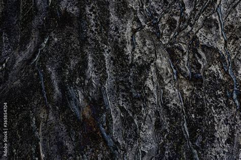 The black texture of natural stone, rock. Close-up of the background ...