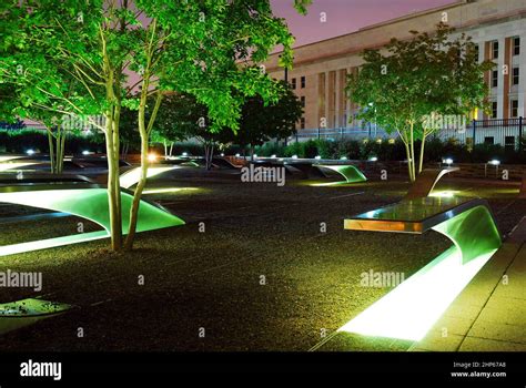 Memorial benches are illuminated at the 9/11 Memorial at the Pentagon ...