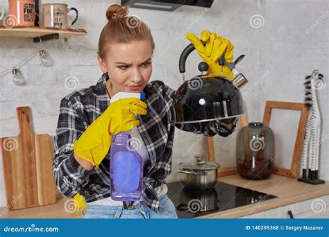 Domestic Service And Housekeeping Concept Happy Blonde Lady Cleaning Kitchen Kettle Stock
