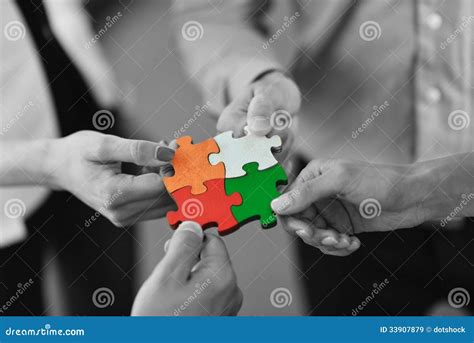 Group Of Business People Assembling Jigsaw Puzzle Royalty Free Stock