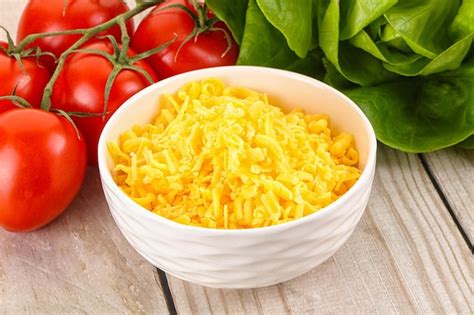 Premium Photo Shredded Cheese In The Bowl