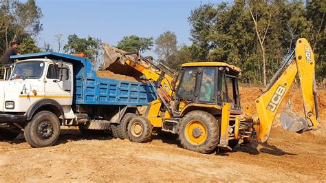 Jcb Backhoe Cutting Soil And Loading In Dump Truck Dump Truck