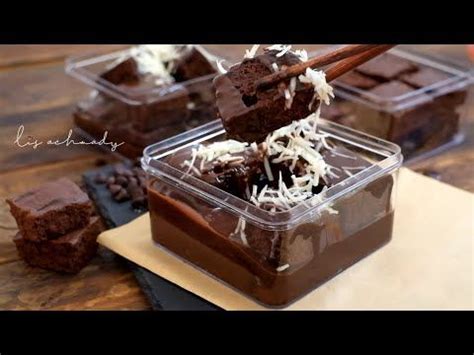 Chocolate Brownies With Coconut On Top In Plastic Containers