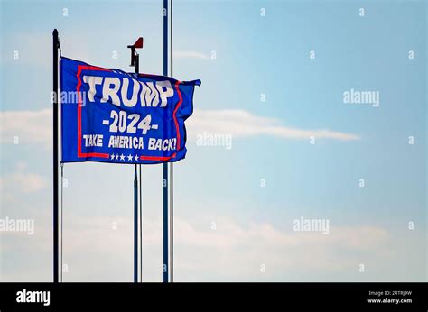 A Trump 2024 flag flies at a pier on Coden Beach, Sept. 11, 2023, in ...