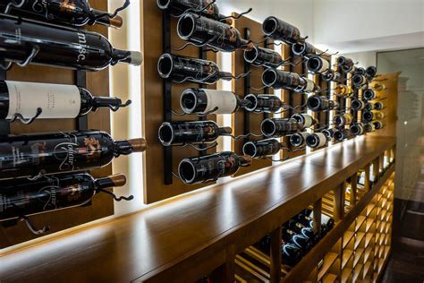 Modern Black Metal Racks Inside Luxury Custom Wine Cellar In Miami