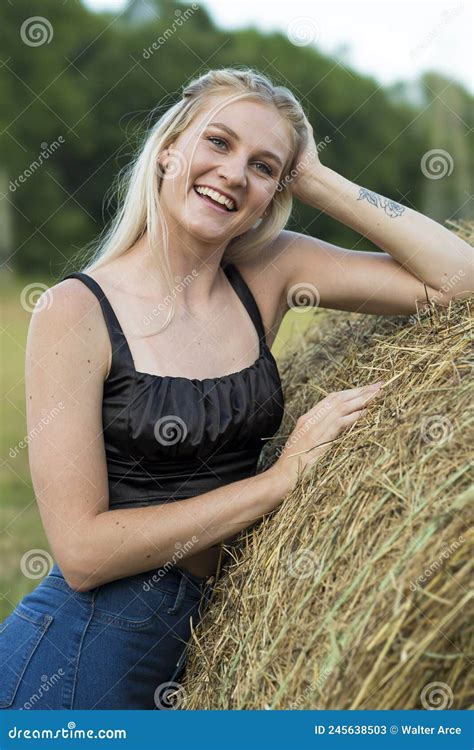 A Lovely Blonde Model Poses Outdoors In A Farm Environment Stock Image Image Of Elegant