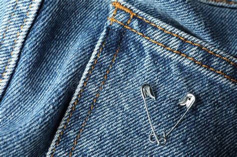 Metal Safety Pins On Denim Fabric Closeup Stock Image Image Of