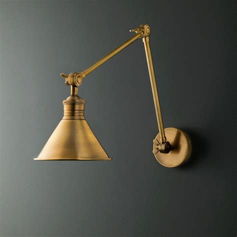 Stork Wall Light In Antique Brass