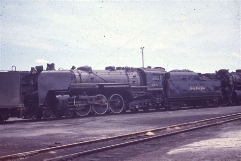 An Old Train Parked On The Tracks