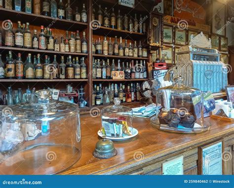 Traditional General Store Bar Shelves With Beverage Bottles Cash