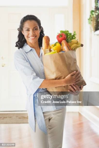 Black Woman Holding Fruit Photos And Premium High Res Pictures Getty