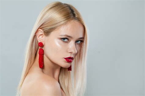 Stylish Fashion Model Woman With Blonde Hair Wears Big Red Color Earrings Fashionable Lady With
