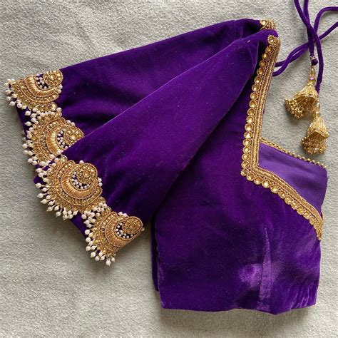 A Purple Cloth With Gold Trim And Tassels