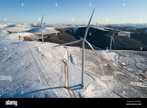 Aerial Image Of The Clyde Wind Farm Extension In Snow On A Bright