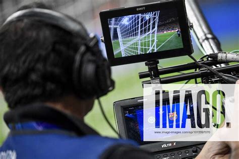 A Cameraman Watches In The Monitors As He Shoots With The Camera