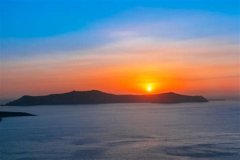 Premium Photo | Fira at sunset, santorini, greece