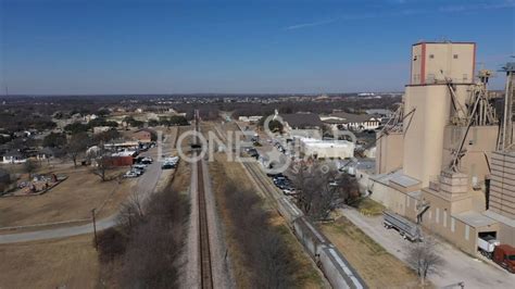 Industrial Building And Houses And Water Tower In Neighborhood In Aledo