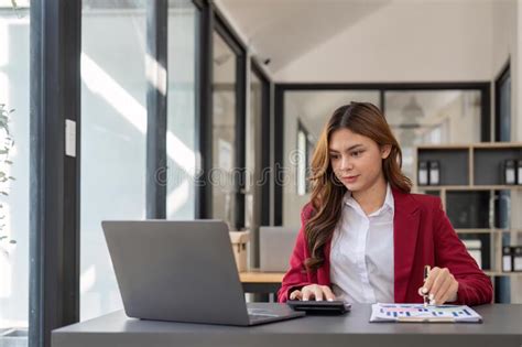 Accountant Woman Working With Calculator And Laptop Computer Tax