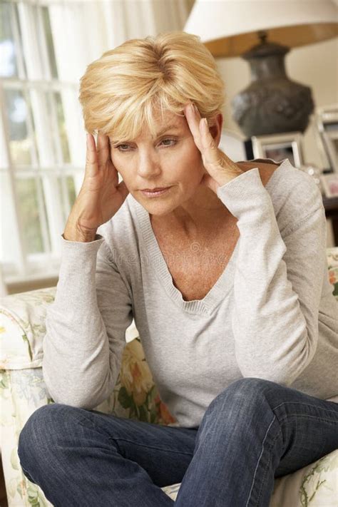 Unhappy Mature Woman Sitting On Sofa At Home Stock Image Image Of