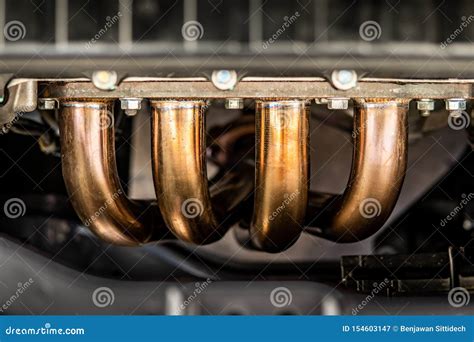 Car engine exhaust header stock image. Image of detail - 154603147