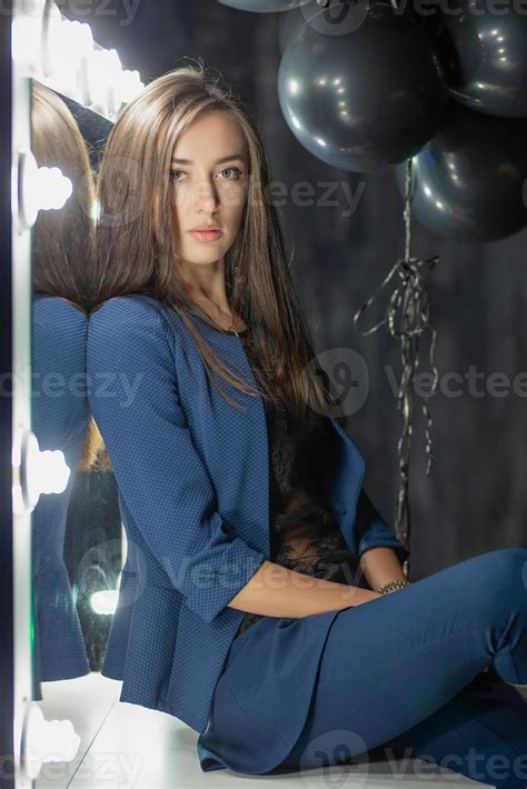 Beautiful Brunette Posing While Sitting 20124548 Stock Photo At Vecteezy