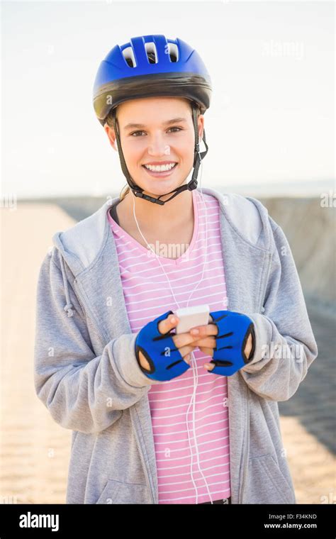 Smiling Sporty Blonde Skater Enjoying Music Stock Photo Alamy