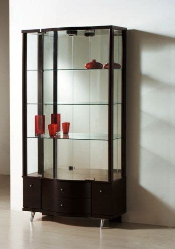 A Glass Display Case With Red Vases On It S Sides In A Room