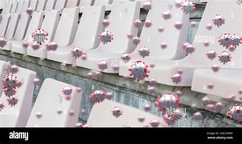 Covid-19 cells against empty seats in sports stadium Stock Photo - Alamy