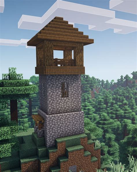 A Tall Tower Sitting On Top Of A Lush Green Forest Filled With Lots Of Trees