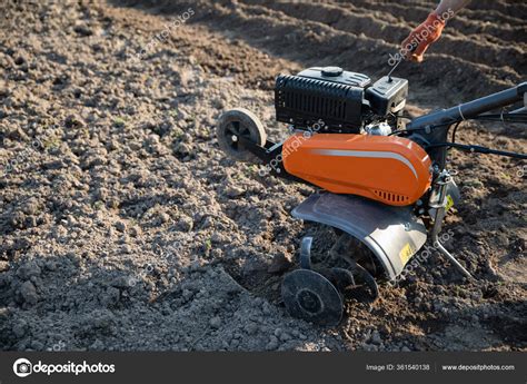 Small Orange Plowing Machine Hands Farmer Making Arable Black Soil ...