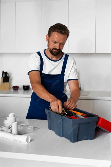 Free Photo | Plumbing professional doing his job