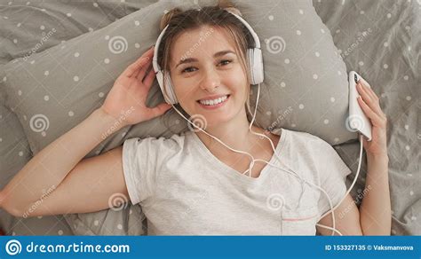 Happy Woman Or Teenage Girl In Headphones Listening To Music From