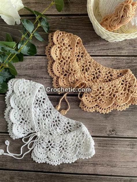 Three Crocheted Doily Sitting On Top Of A Wooden Table Next To Flowers