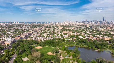 Aerial View Above Humboldt Park Lagoon With Chicago Skyline