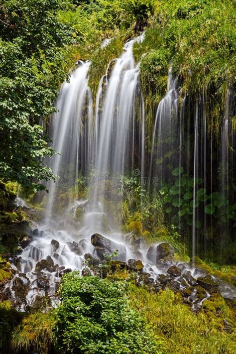 Vertical Long Exposure Shot Of The Mossbrae Falls In Dunsmuir Stock