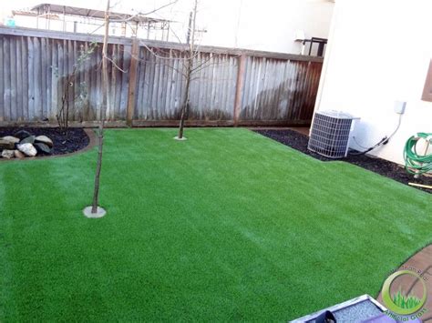 Backyard With A Concrete Patio In Fairfield California Synthetic And Artificial Grass In Bay